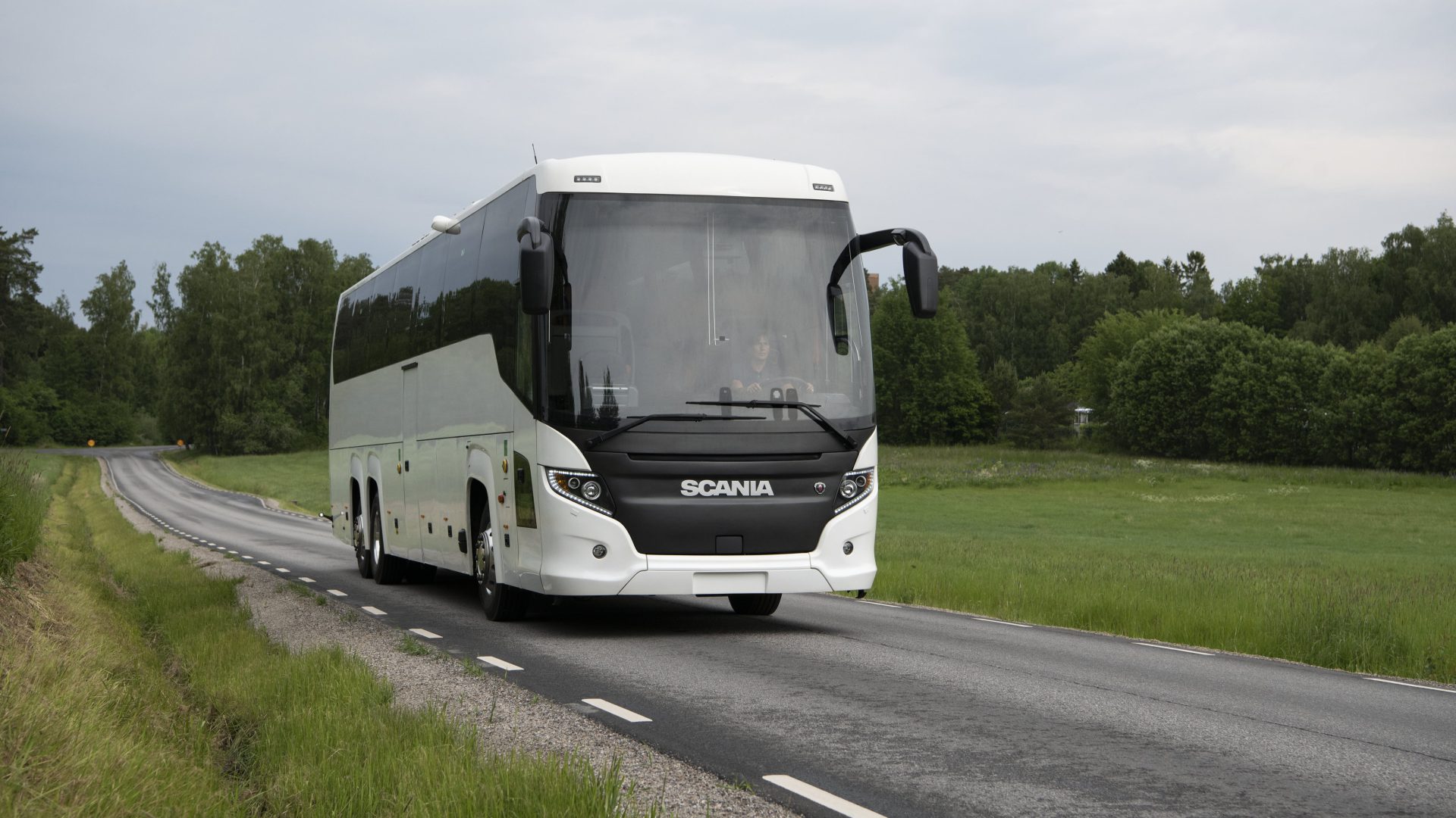 Scania Touring HD 3-axle with steered tag axle.